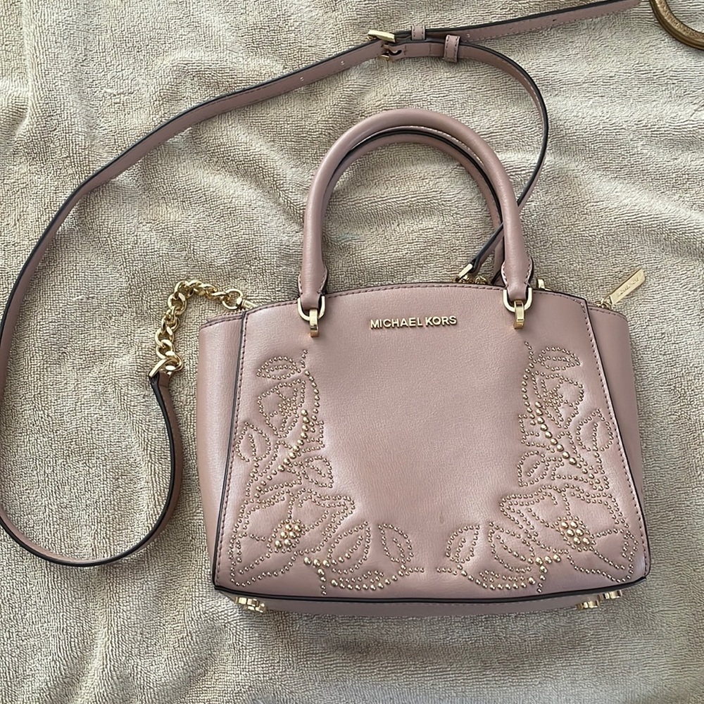 Michael Kors Pink leather cross body bag with gold floral accents